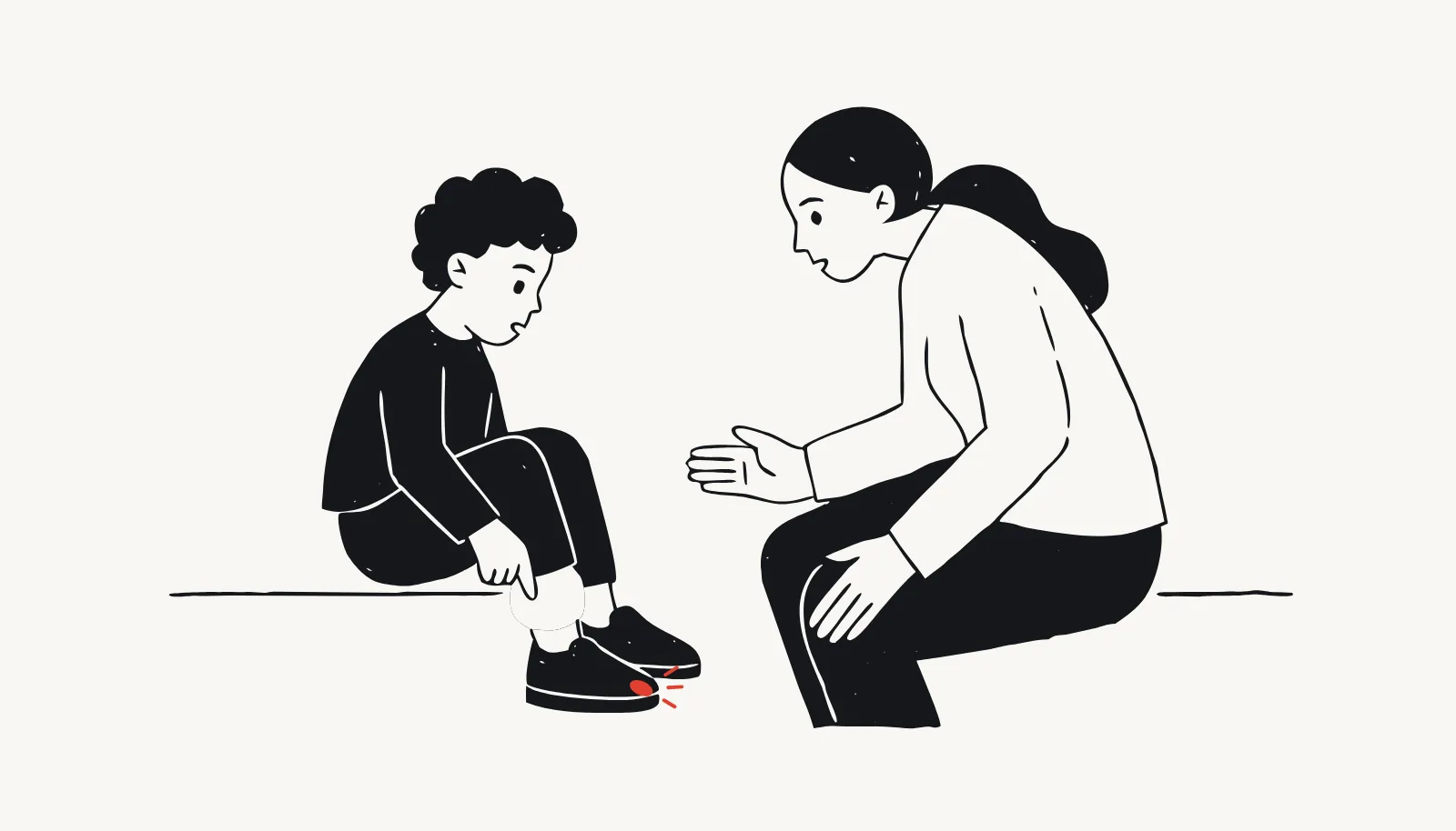 A boy points at the toe of a shoe that has become too tight.